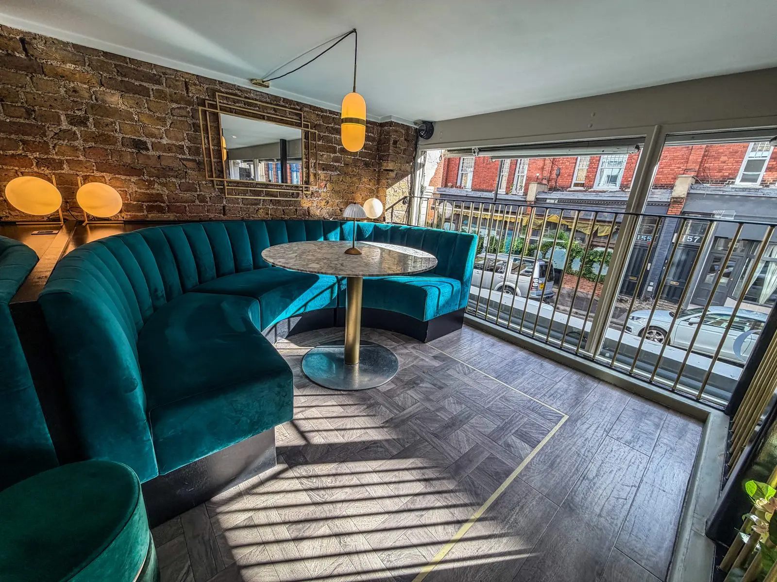 The Mezzanine Lounge at Teatro: teal velvet booths overlooking the restaurant